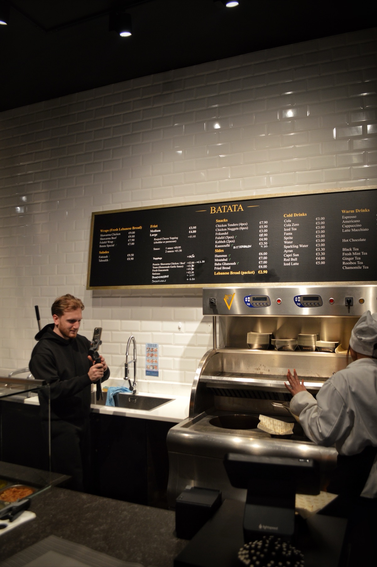 Alec Kouloujian filming content at Batata